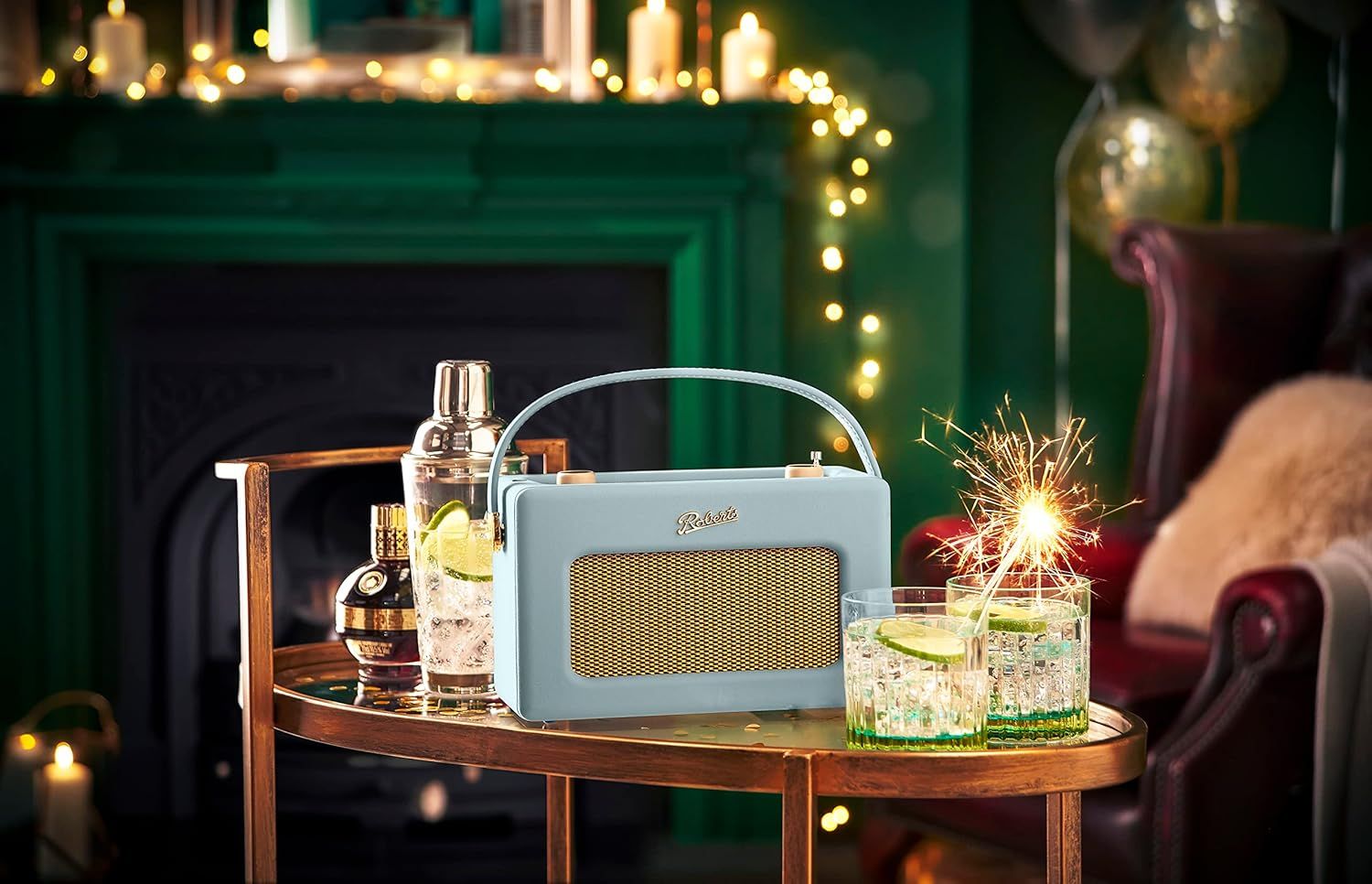 A Roberts Revival iStream 3L radio in classic cream livery with a leather carrying strap