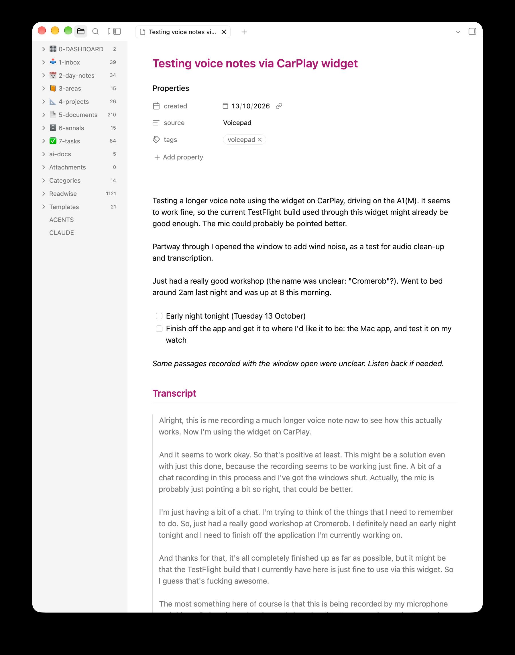 A note in Obsidian titled ‘Testing voice notes via CarPlay widget’: a short summary, two tasks, an italic line saying some passages recorded with the window open were unclear, and the transcript underneath