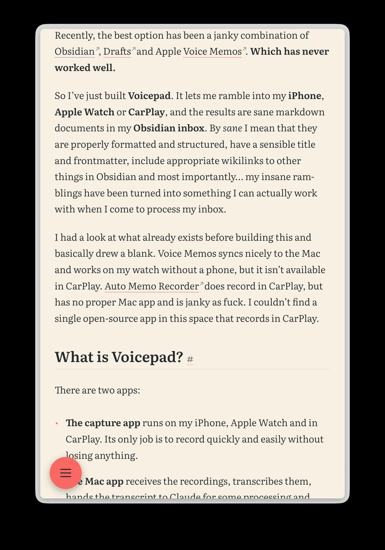 An article on a phone-sized screen with a round coral menu button floating in the bottom-left corner