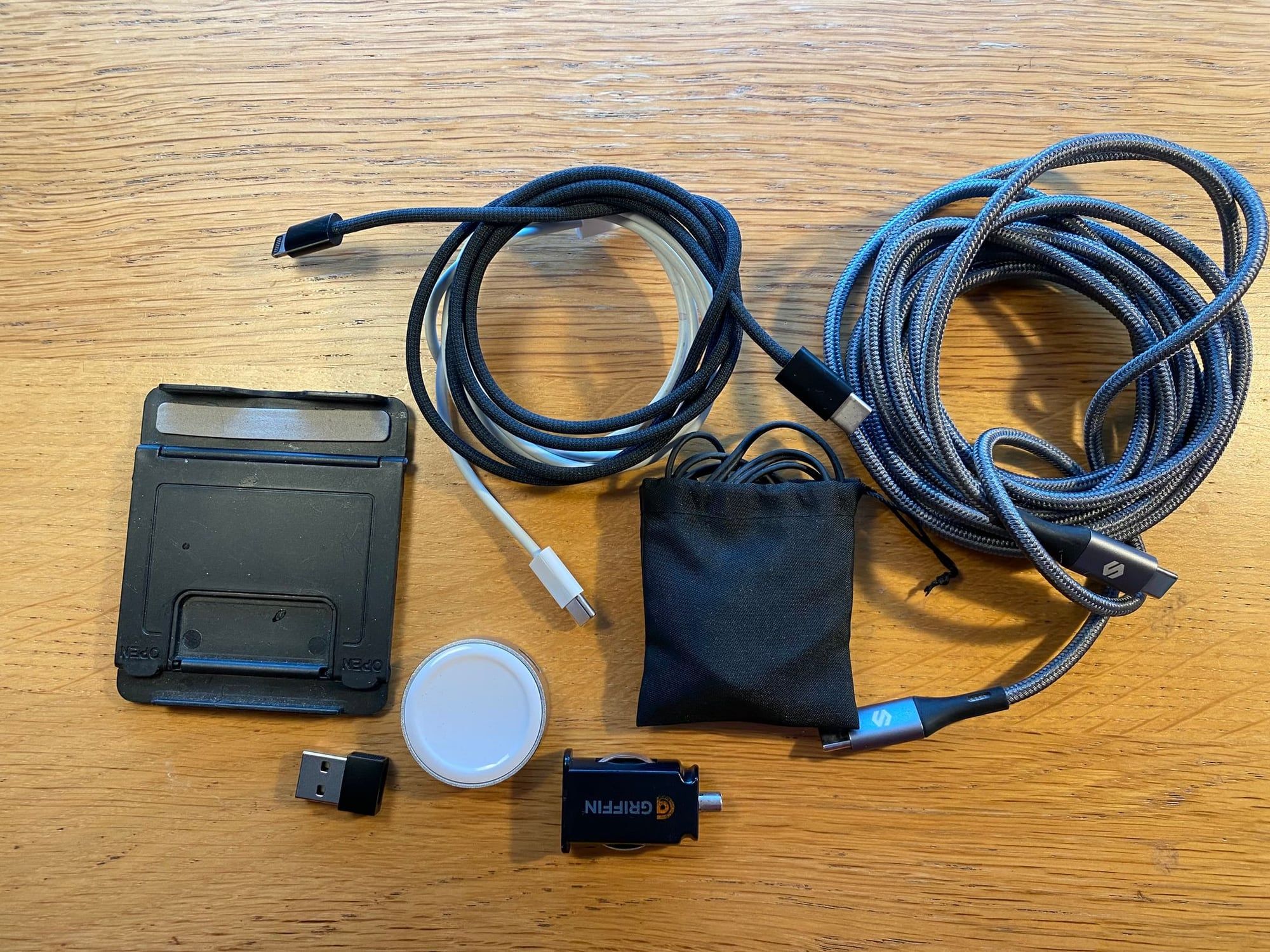 A roll of cables and adaptors laid out