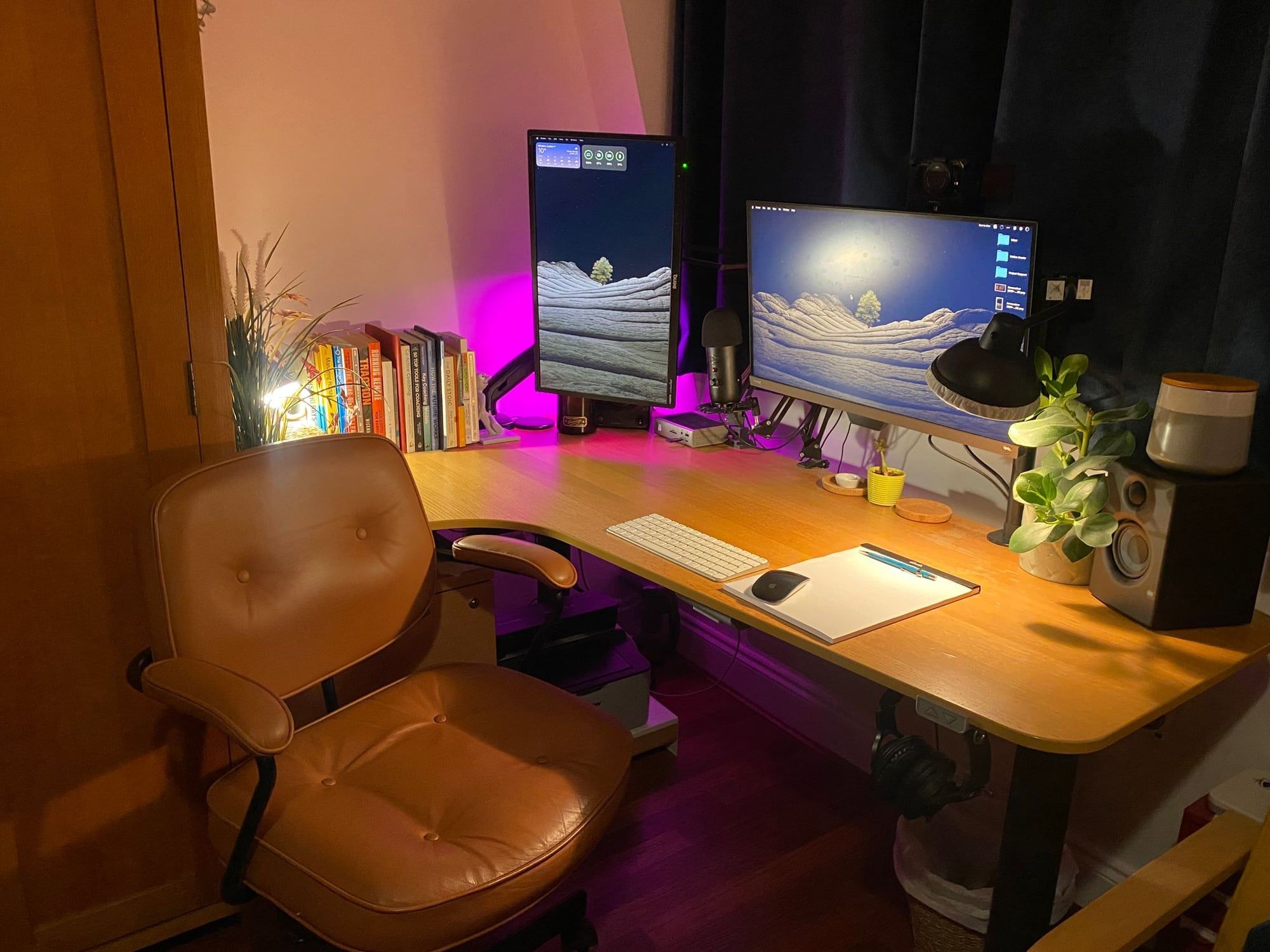 Corner desk in sitting position with a brown leather office chair