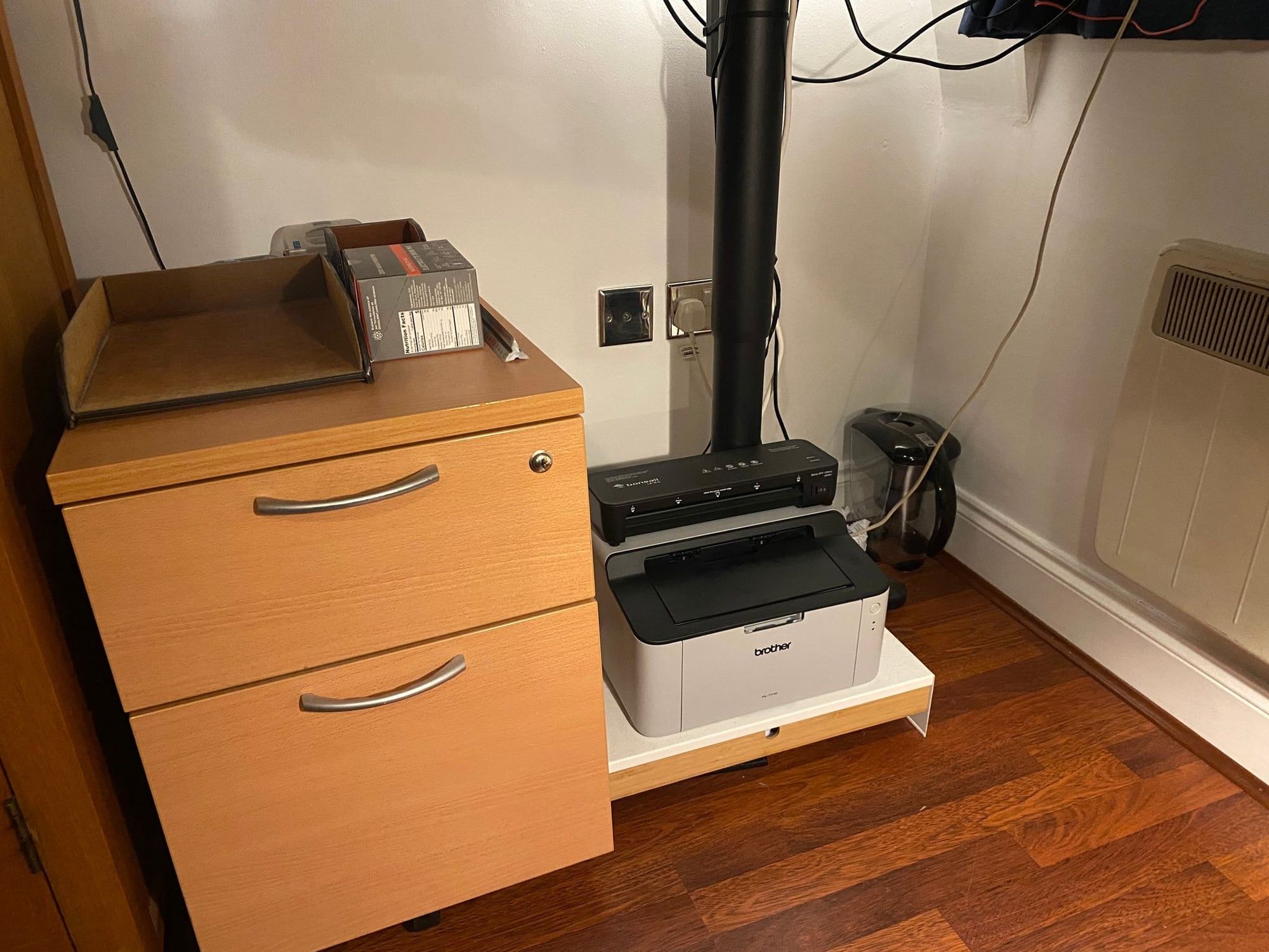 The filing pedestal under the left of the desk