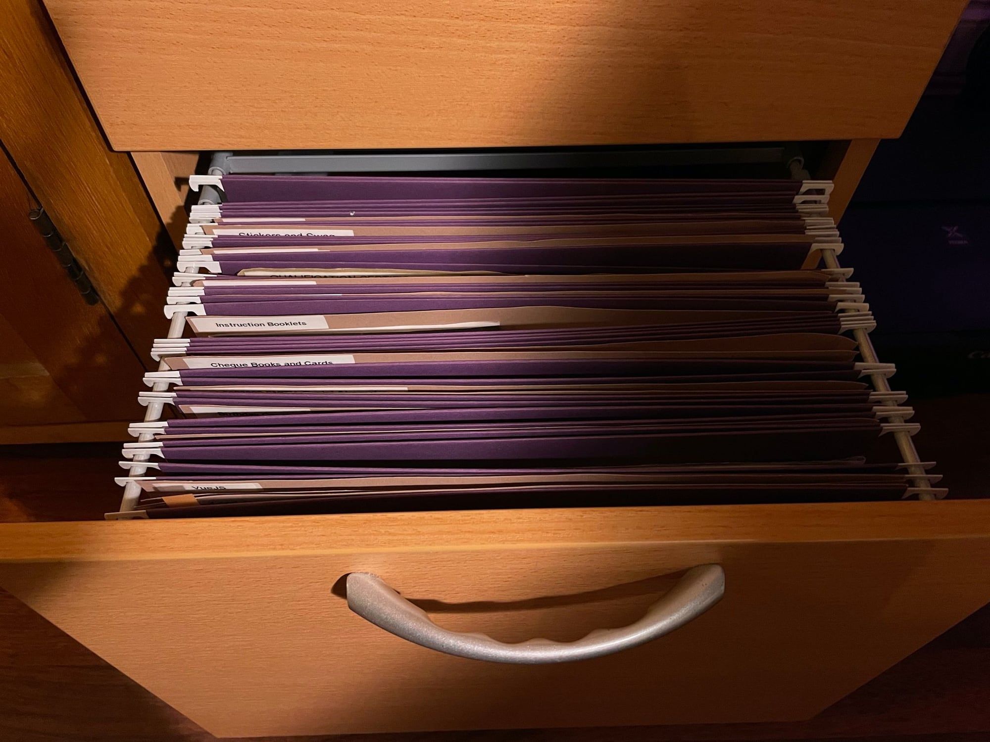 A drawer of labelled buff folders
